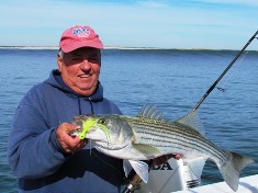 Here's Don Eichin with a perfectly proportioned schoolie bass caught and released off the West End on an  Asgard bucktail. Photo by Capt. Joey Leggio, Chasin' Tail TV.